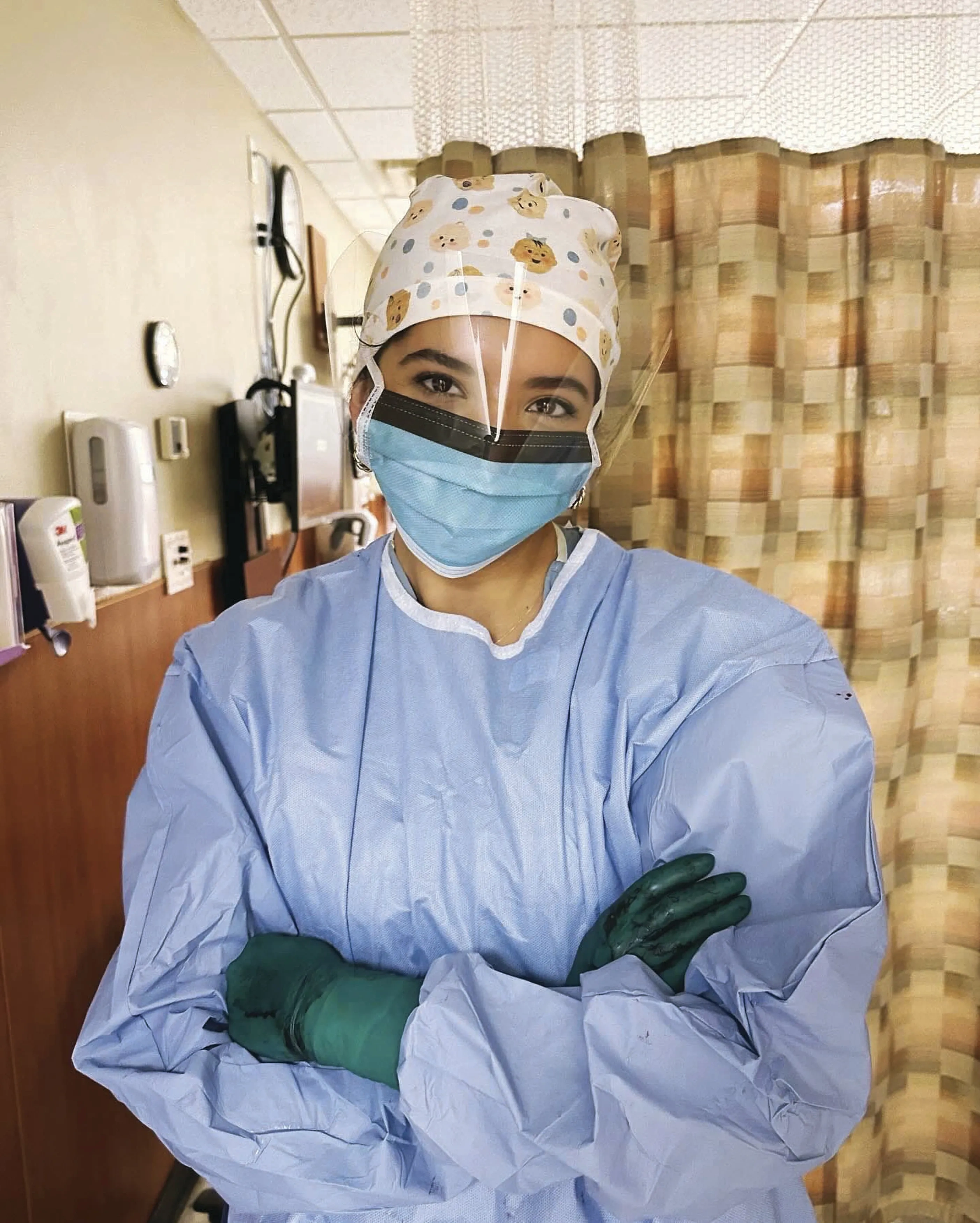 Janelle Chaves in her delivering physician gear
